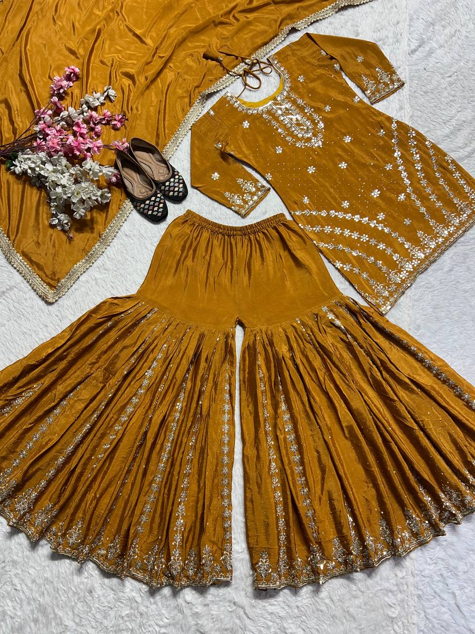 PURE HEAVY CHINNON SILK WITH HEAVY EMBROIDERY WORK WITH FANCY BORDERS LESS WORK SLEEVE WITH FANCY LATKAN DORI. WHOLESALE GEELAN FASHION SURAT