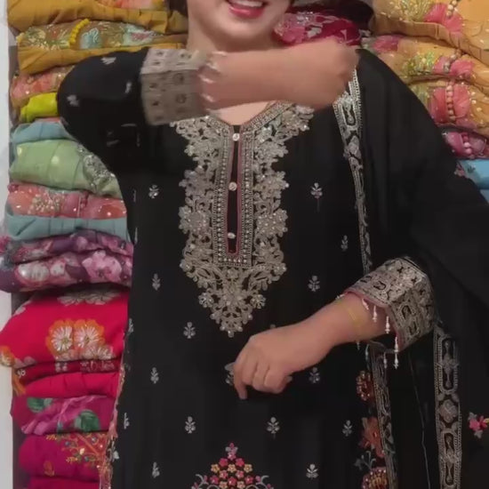 Designer black embroidered Pakistani suit with elegant neckline and matching dupatta for women.
